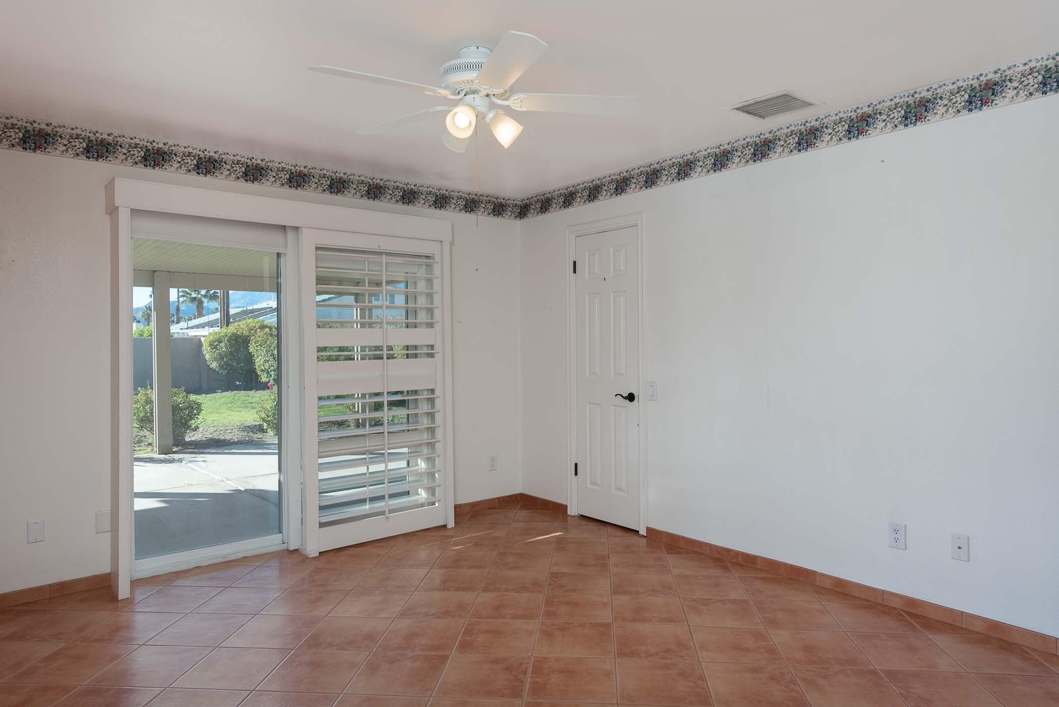 67705 Ovante Road Cathedral City, CA 92234 - Photo 16 of 34 a view of an empty room with a window