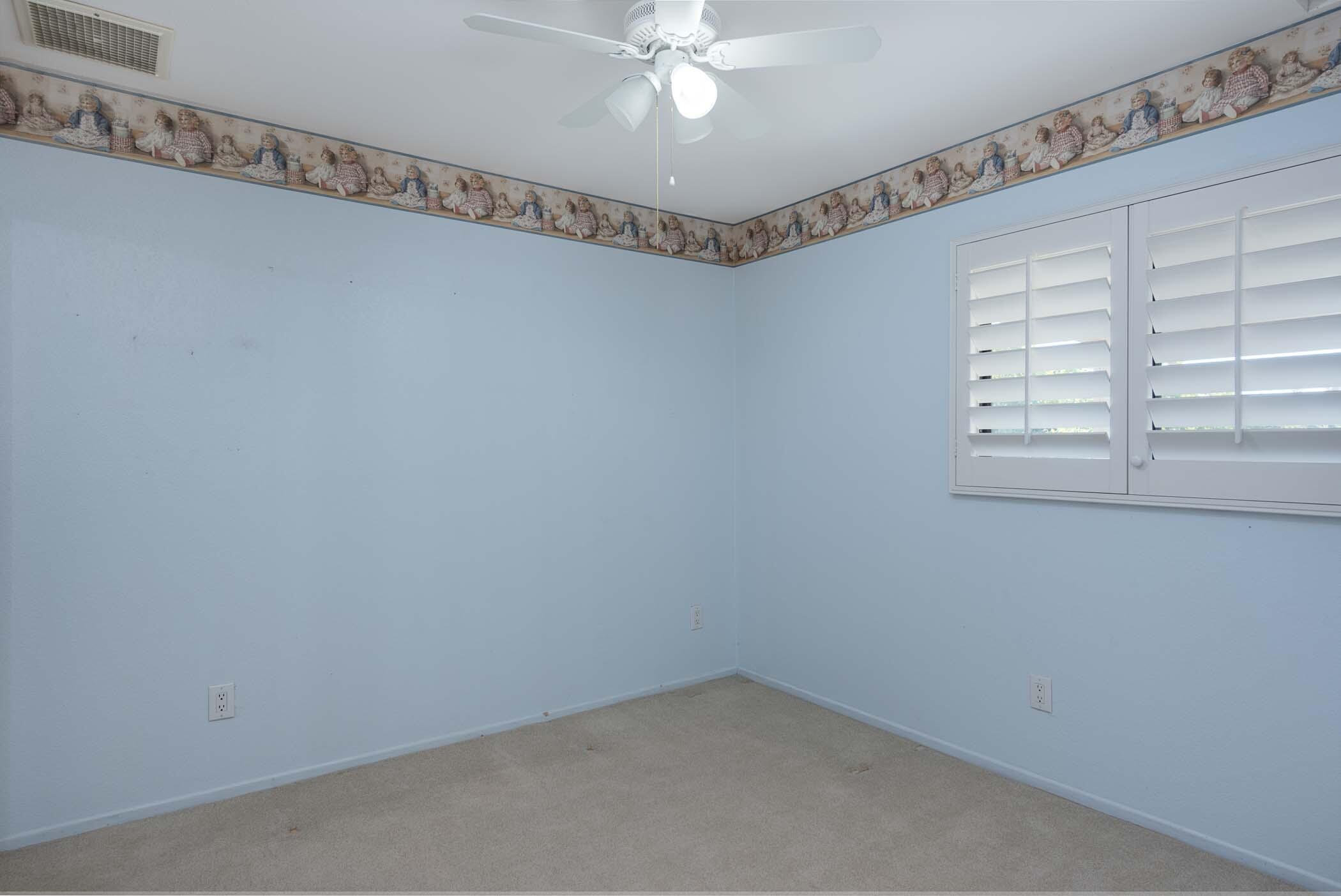 67705 Ovante Road Cathedral City, CA 92234 - Photo 24 of 34 a view of a room with window and a fan