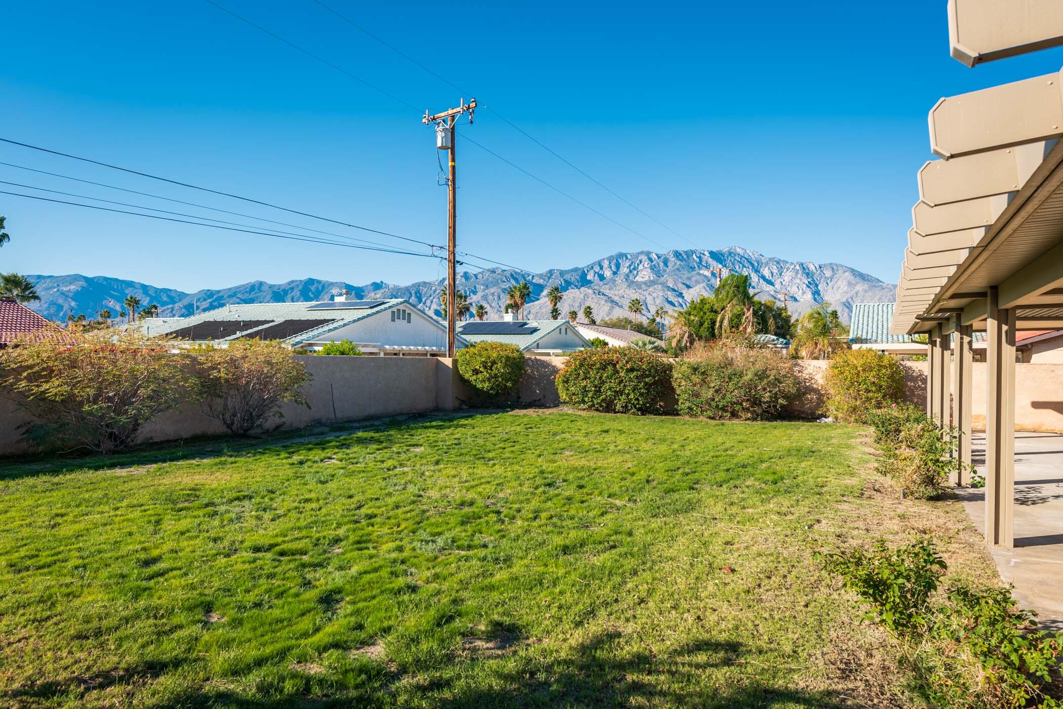 67705 Ovante Road Cathedral City, CA 92234 - Photo 30 of 34 a view of a backyard with plants