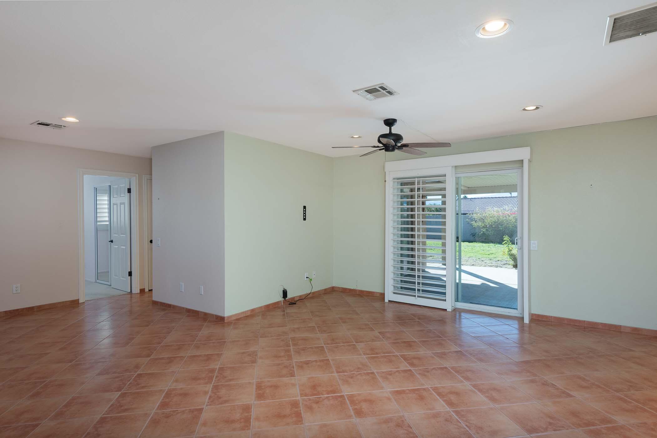 67705 Ovante Road Cathedral City, CA 92234 - Photo 6 of 34 a view of an empty room with a window