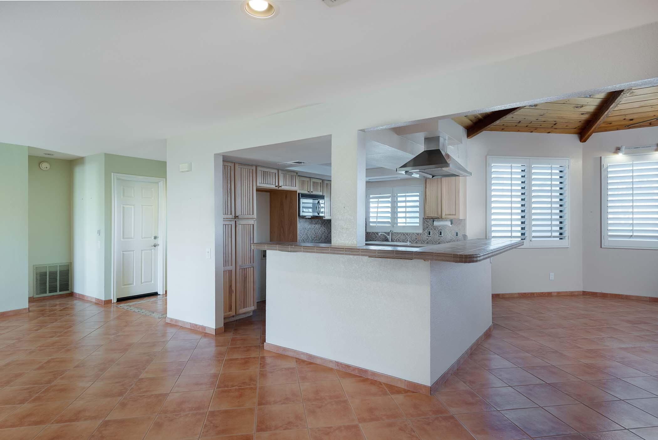 67705 Ovante Road Cathedral City, CA 92234 - Photo 9 of 34 a view of kitchen with cabinets and wooden floor