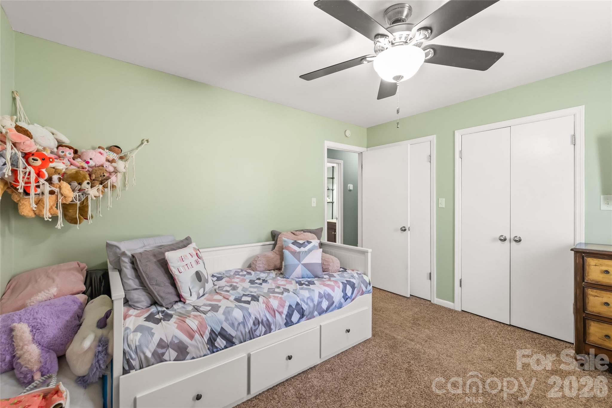 104 Pine Tree Drive Fort Mill, SC 29715 - Photo 13 of 35 a bedroom with a bed and ceiling fan