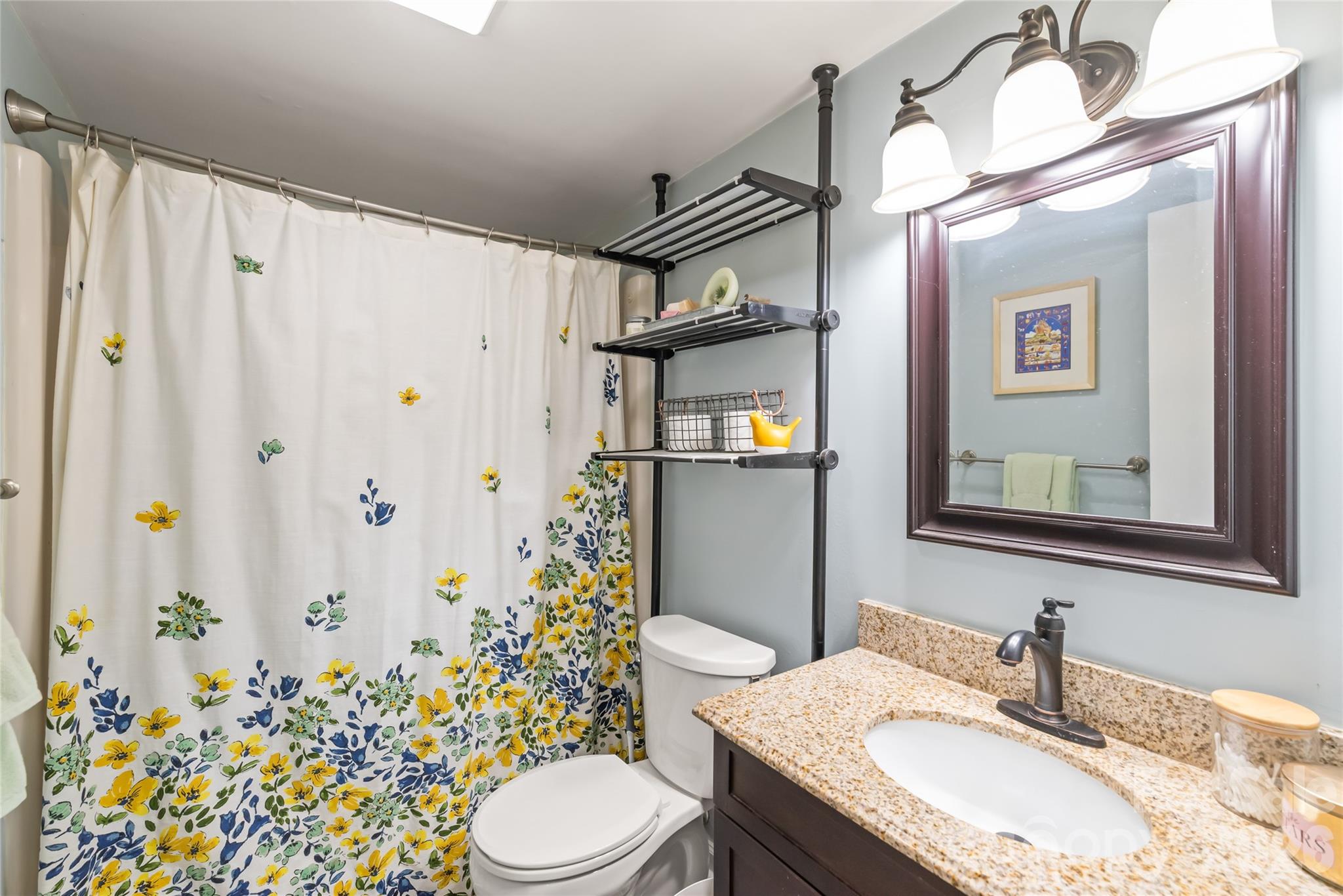 104 Pine Tree Drive Fort Mill, SC 29715 - Photo 15 of 35 a bathroom with a granite countertop sink toilet and shower