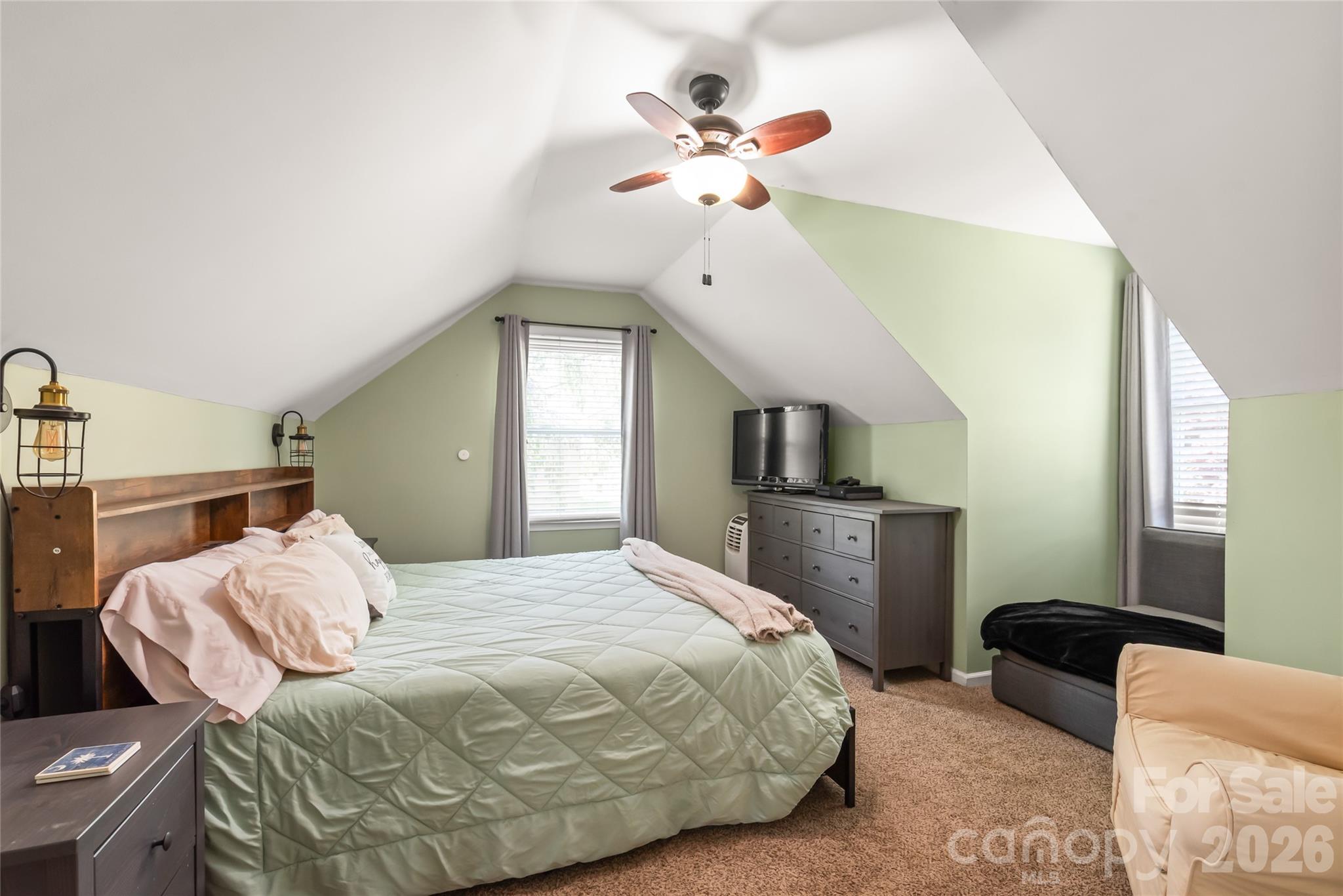 104 Pine Tree Drive Fort Mill, SC 29715 - Photo 20 of 35 a bedroom with a large bed and a chandelier