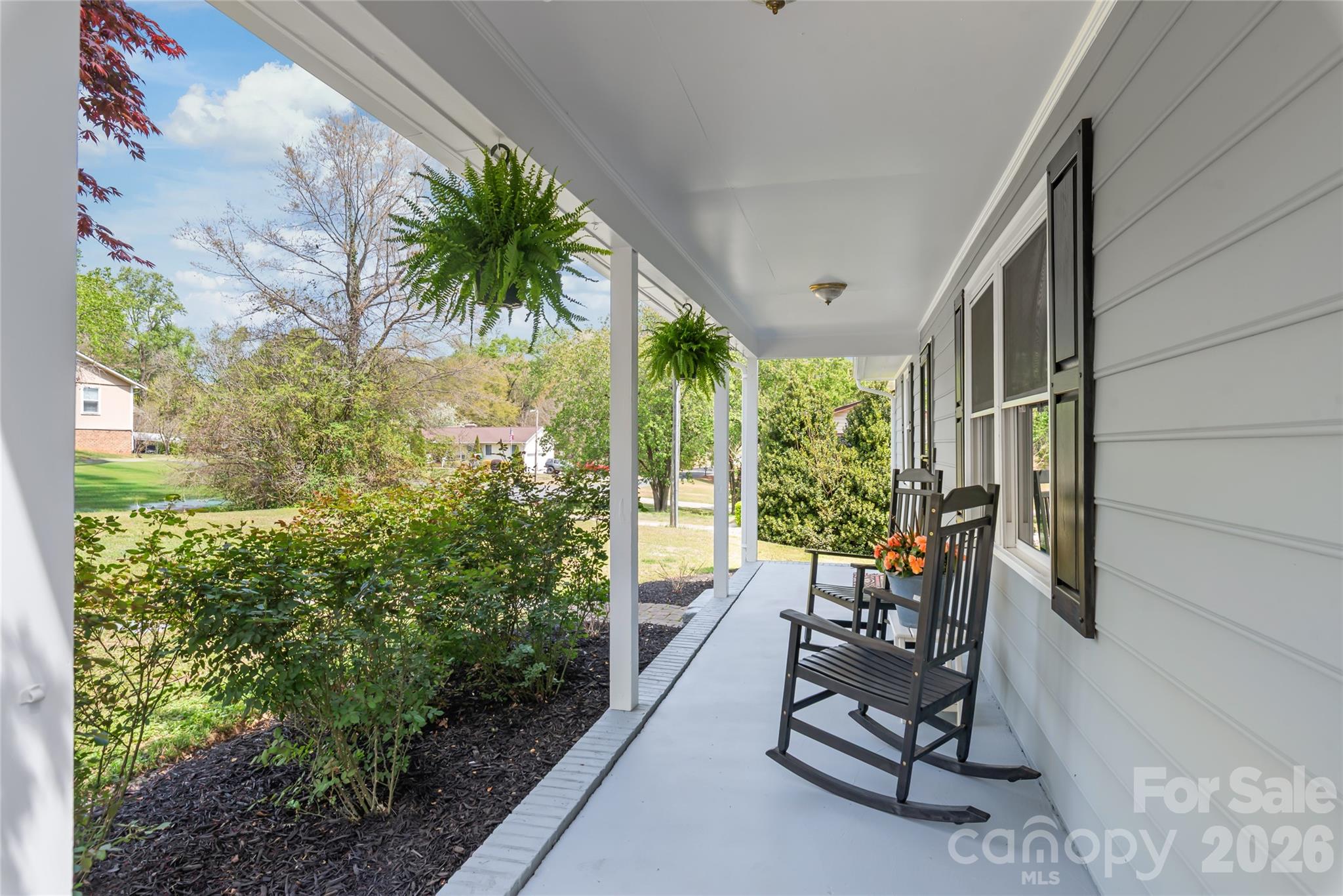 104 Pine Tree Drive Fort Mill, SC 29715 - Photo 2 of 35 a view of a porch with furniture and a yard