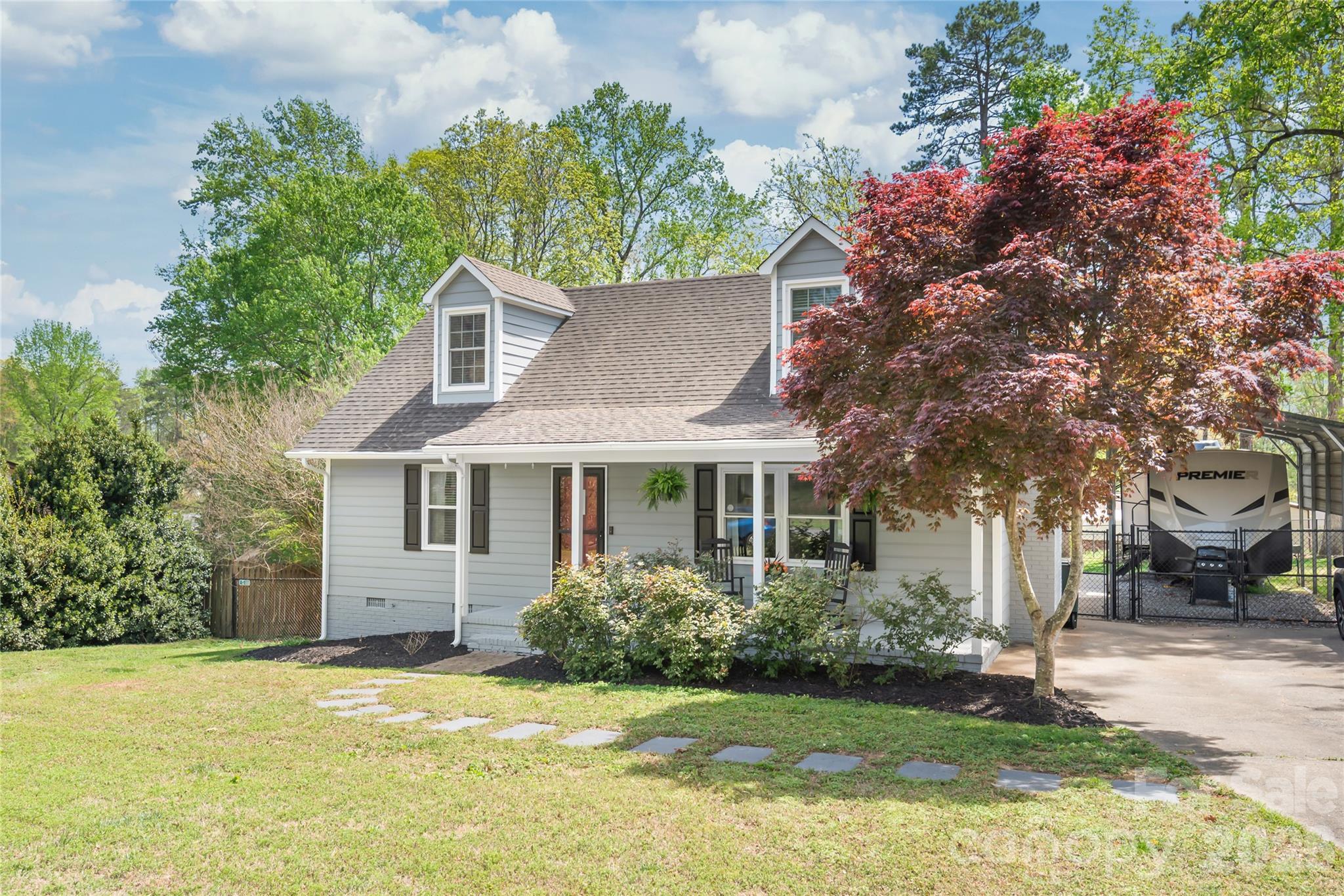 104 Pine Tree Drive Fort Mill, SC 29715 - Photo 21 of 35 a view of a house with a yard and potted plants