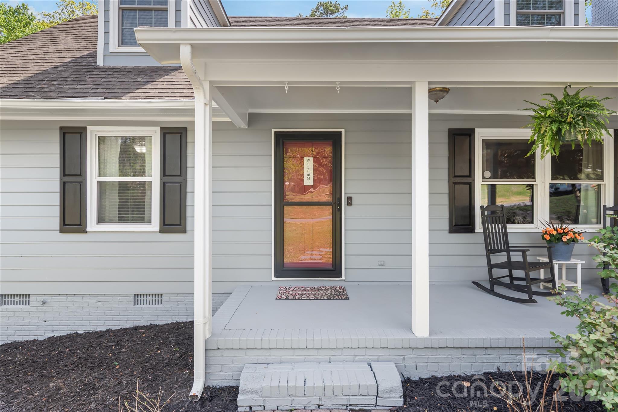 104 Pine Tree Drive Fort Mill, SC 29715 - Photo 3 of 35 a front view of a house with outdoor seating