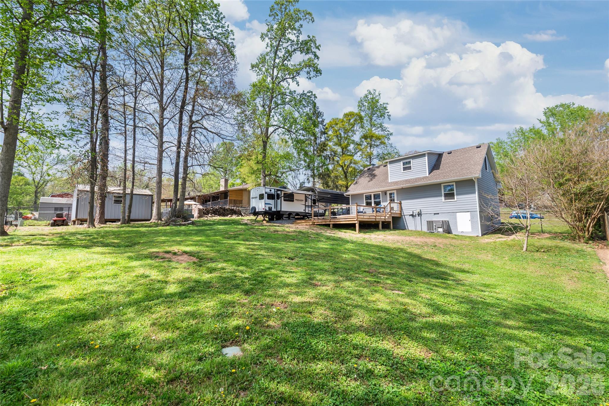 104 Pine Tree Drive Fort Mill, SC 29715 - Photo 31 of 35 a view of a house with a big yard and large trees