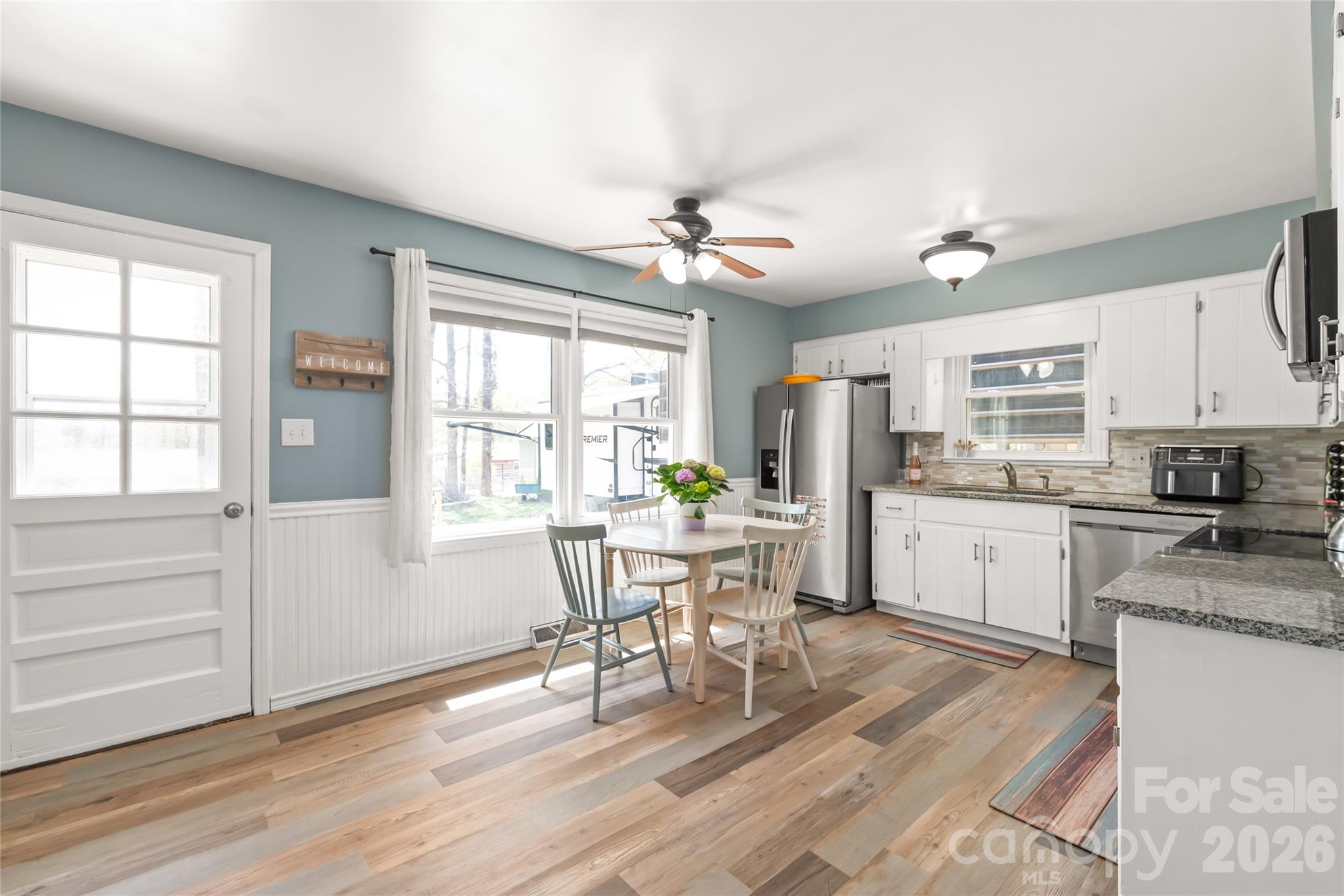 104 Pine Tree Drive Fort Mill, SC 29715 - Photo 8 of 35 a kitchen with granite countertop appliances cabinets and furniture