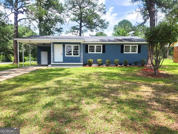 front view of a house with a yard
