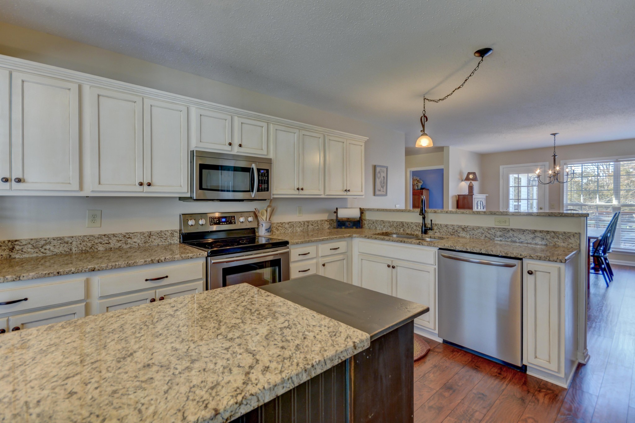 2545 Plainview Pvt Ln Spring Hill Spring Hill, TN 37174 - Photo 14 of 34 a kitchen with granite countertop wooden cabinets and a stove