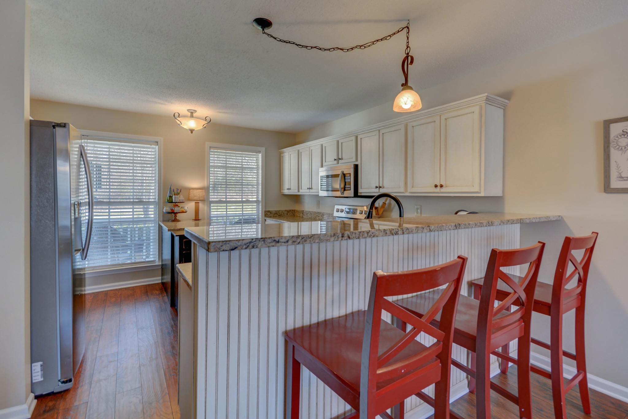 2545 Plainview Pvt Ln Spring Hill Spring Hill, TN 37174 - Photo 15 of 34 a kitchen with granite countertop wooden cabinets and dining table
