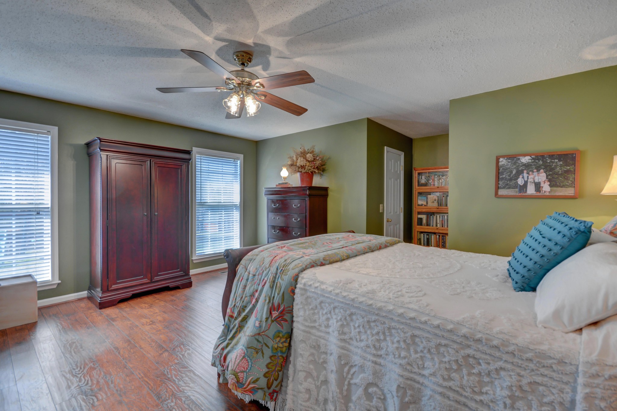 2545 Plainview Pvt Ln Spring Hill Spring Hill, TN 37174 - Photo 16 of 34 a bedroom with a large bed and a chandelier