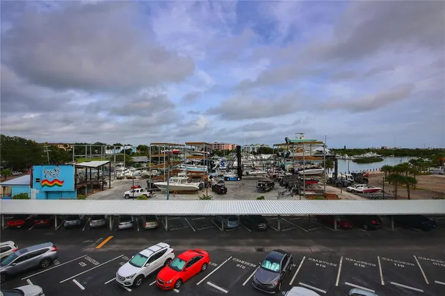 a view of city from a balcony with outdoor seating
