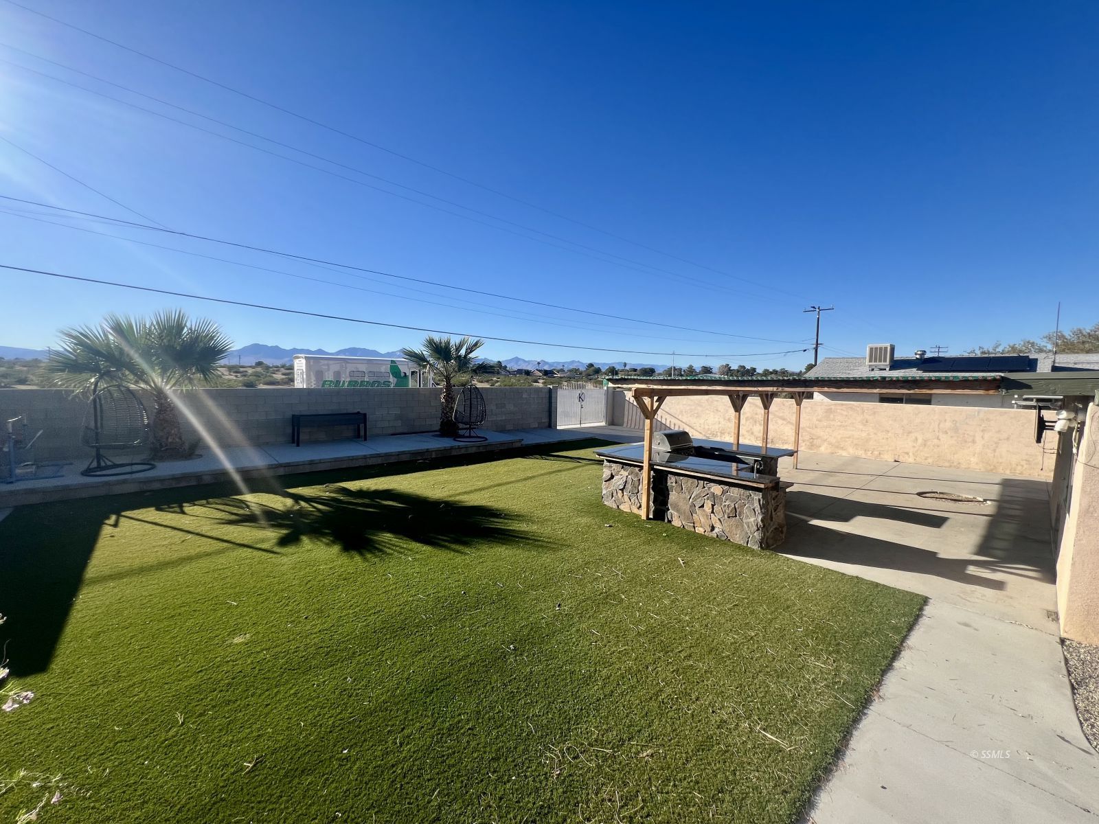 333 Traci Lane Ridgecrest, CA 93555 - Photo 27 of 30 a view of a swimming pool with an outdoor seating and a balcony