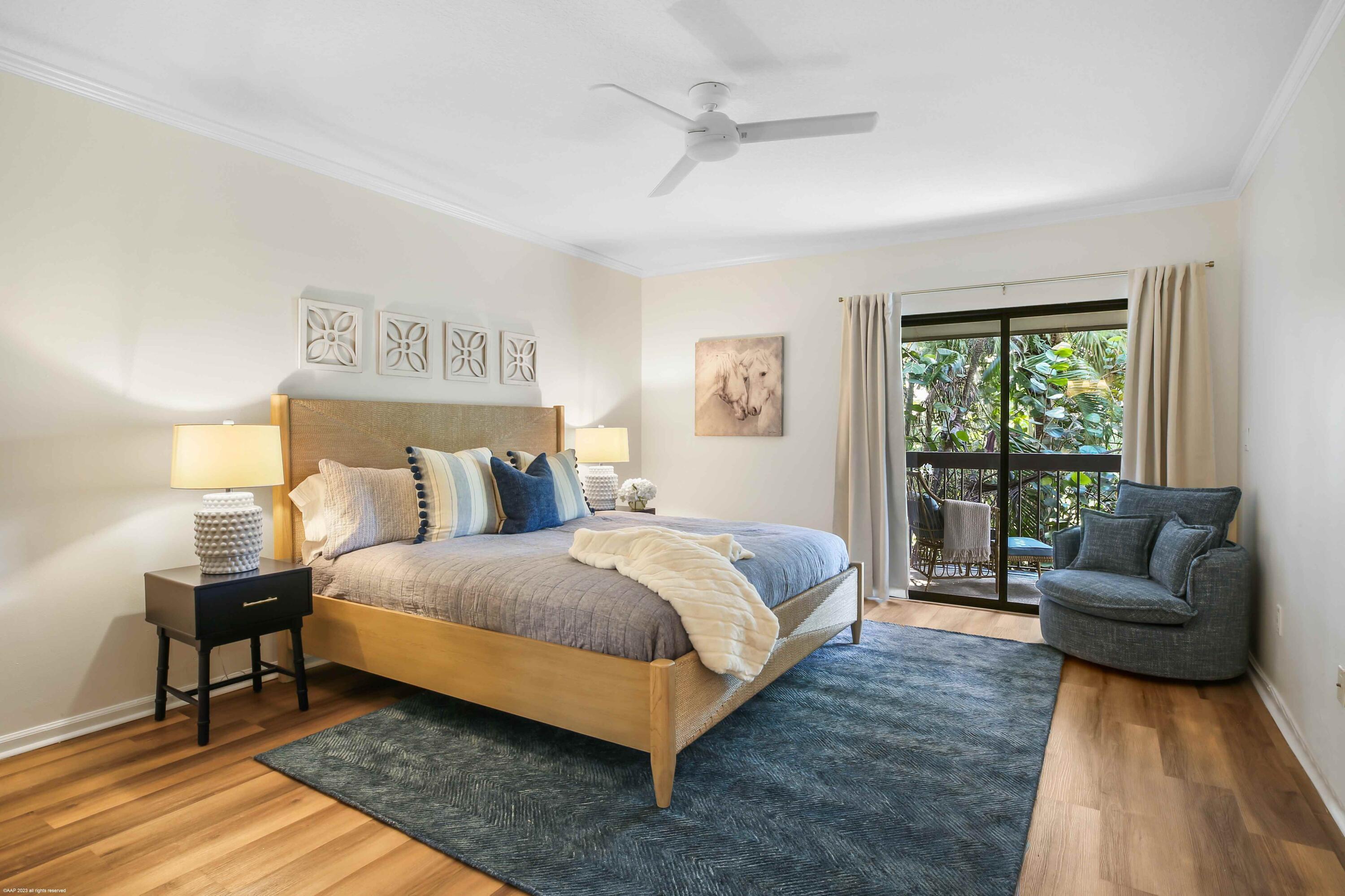 13334 Polo Club Road, Unit 346 Wellington, FL 33414 - Photo 11 of 19 a spacious bedroom with a bed and a couch