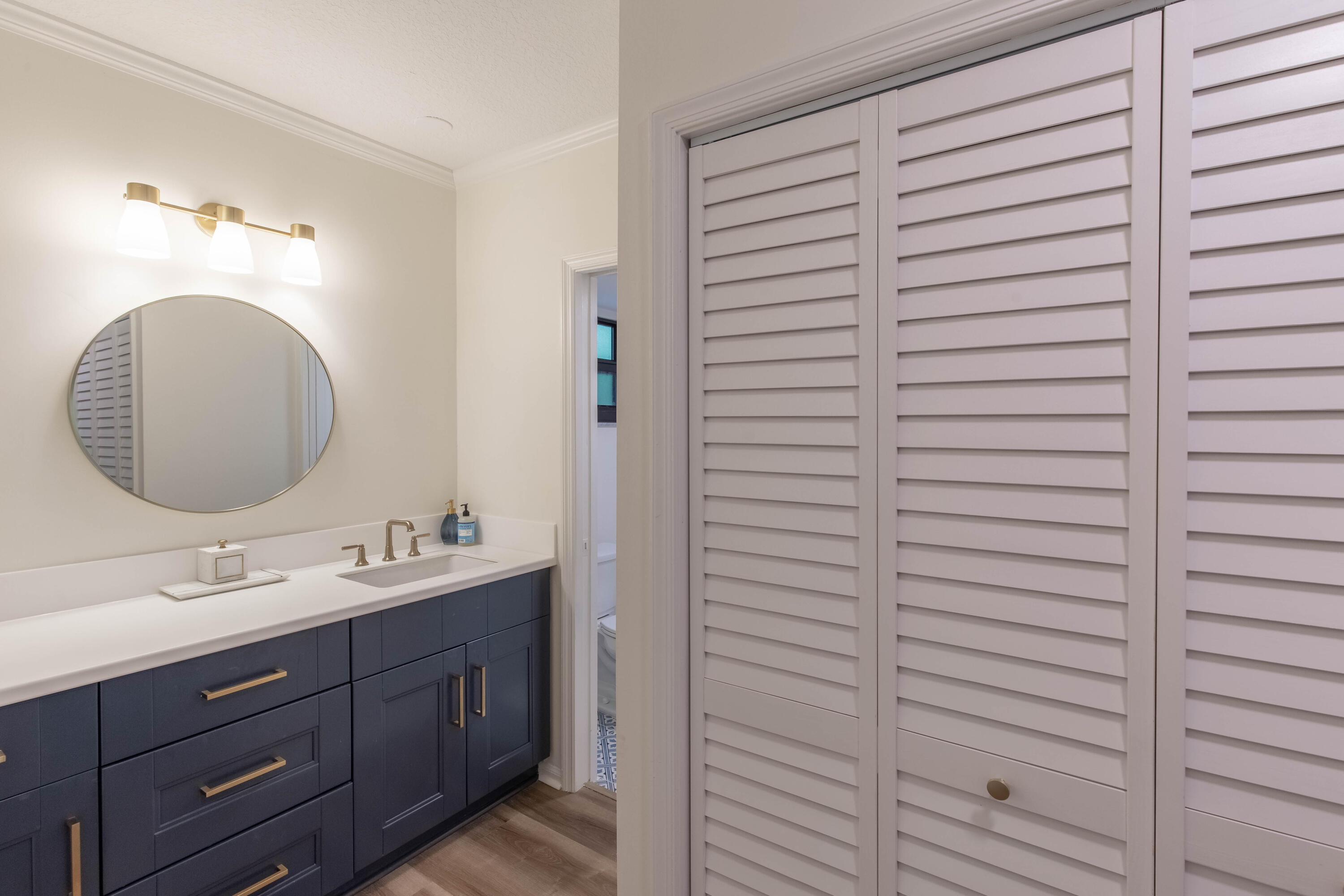 13334 Polo Club Road, Unit 346 Wellington, FL 33414 - Photo 12 of 19 a bathroom with a double vanity sink and a mirror