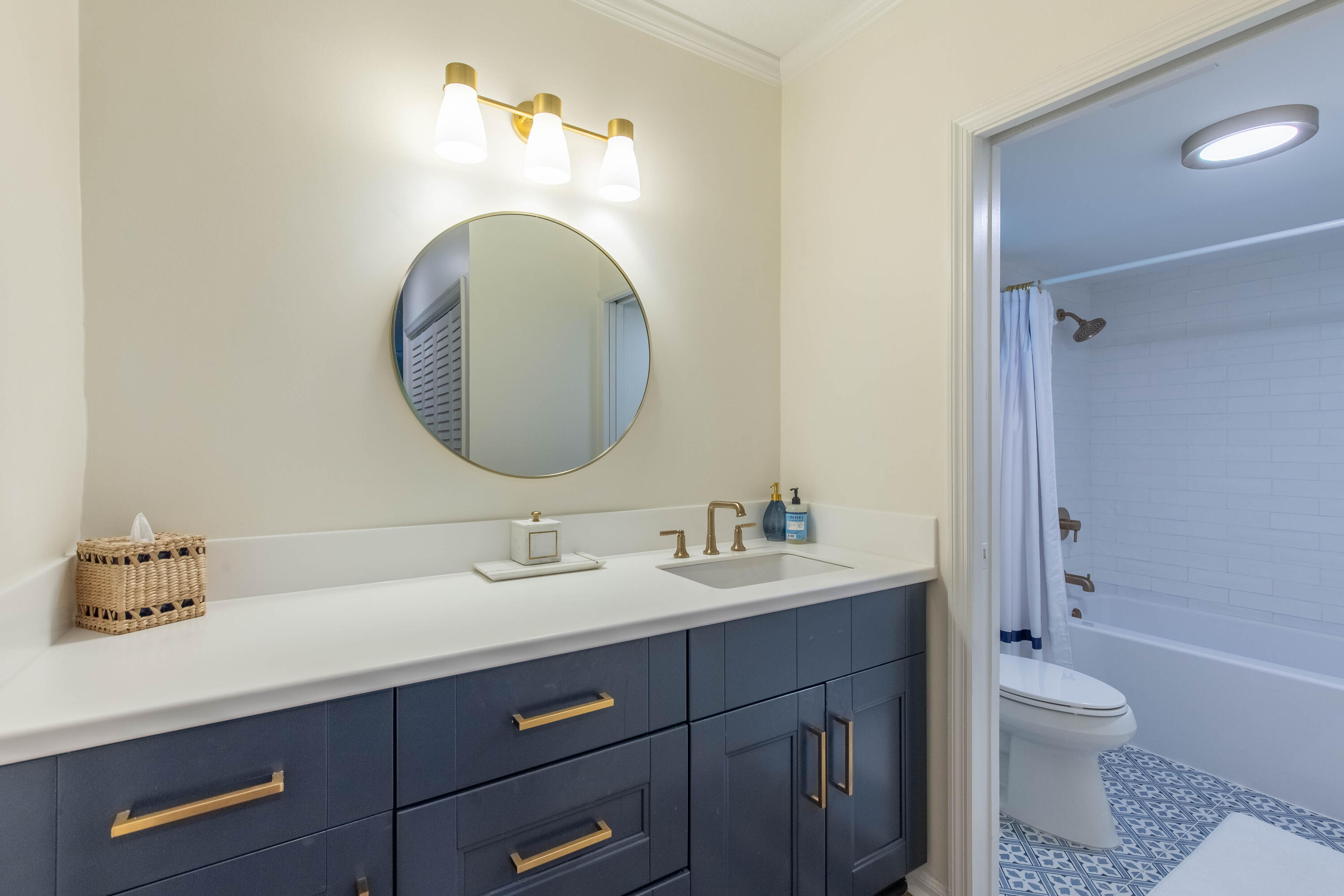 13334 Polo Club Road, Unit 346 Wellington, FL 33414 - Photo 13 of 19 a bathroom with a toilet sink and mirror