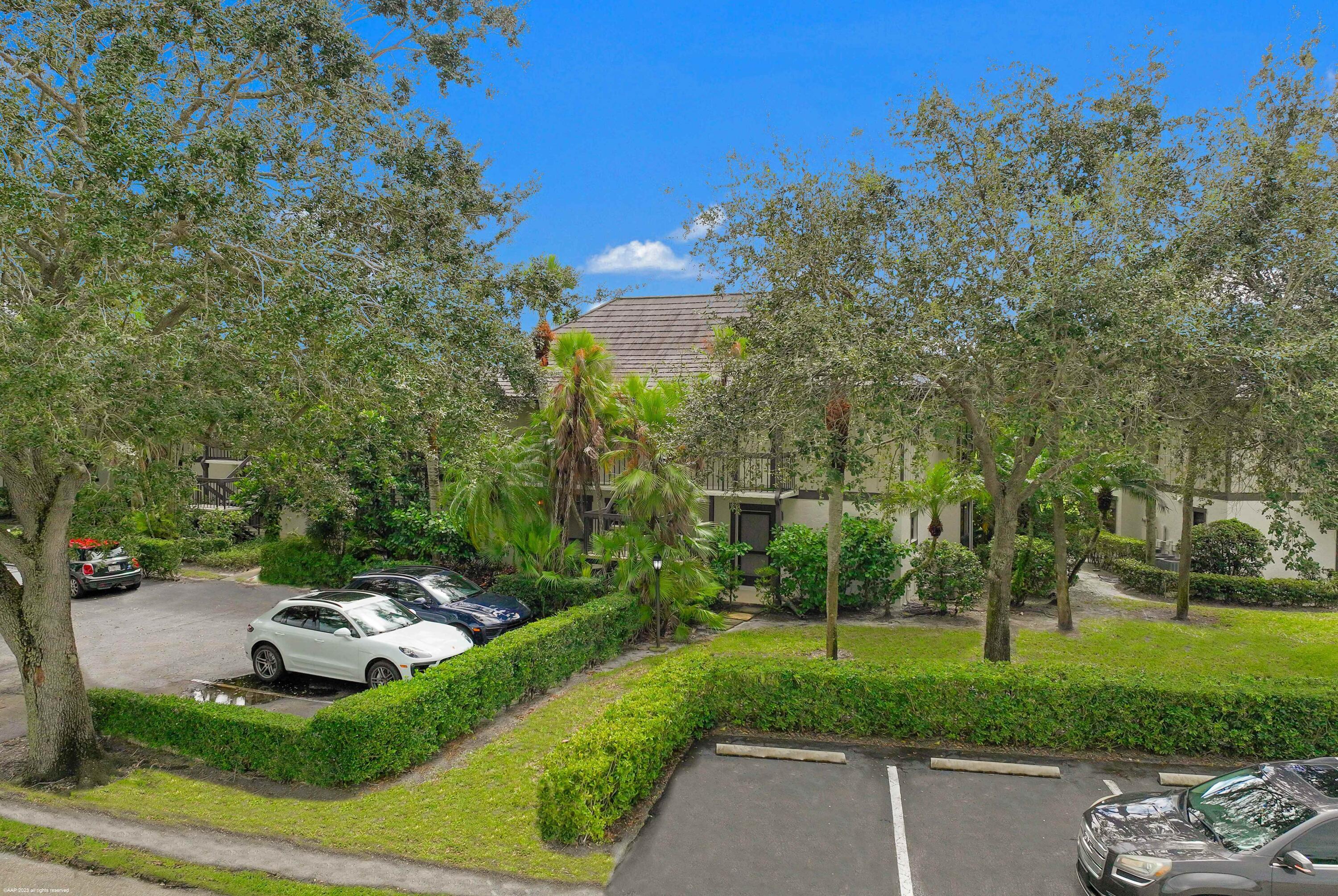 13334 Polo Club Road, Unit 346 Wellington, FL 33414 - Photo 17 of 19 a view of a park with large trees