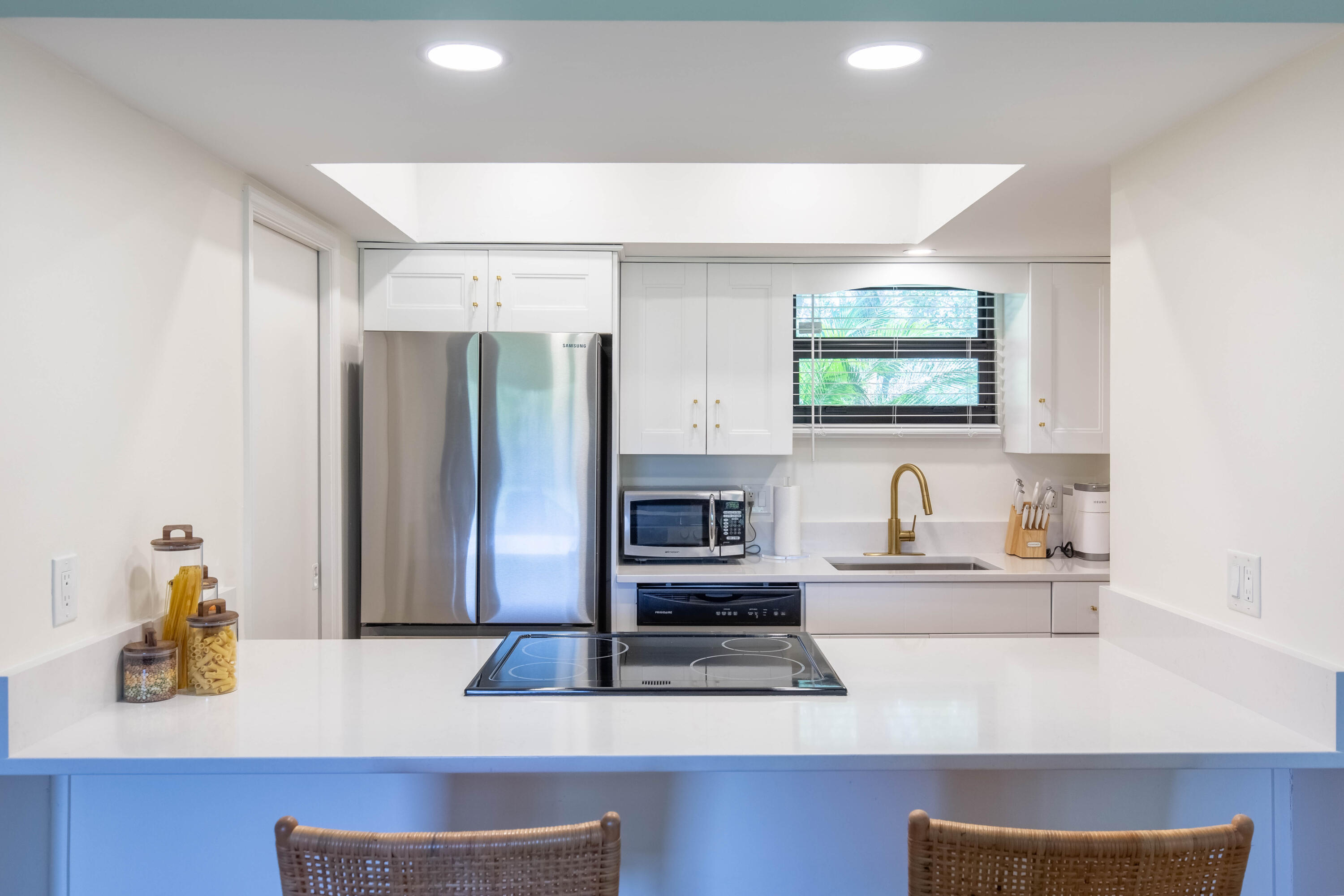 13334 Polo Club Road, Unit 346 Wellington, FL 33414 - Photo 6 of 19 a kitchen with stainless steel appliances a sink cabinets and a refrigerator