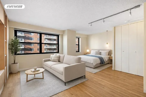 a spacious bedroom with a bed a couch and a window