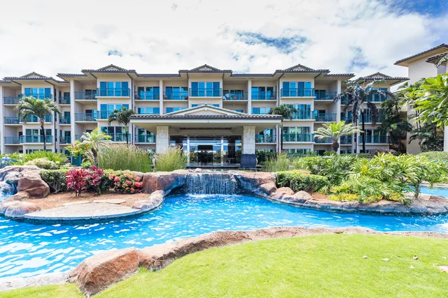 a view of a house with swimming pool and sitting area