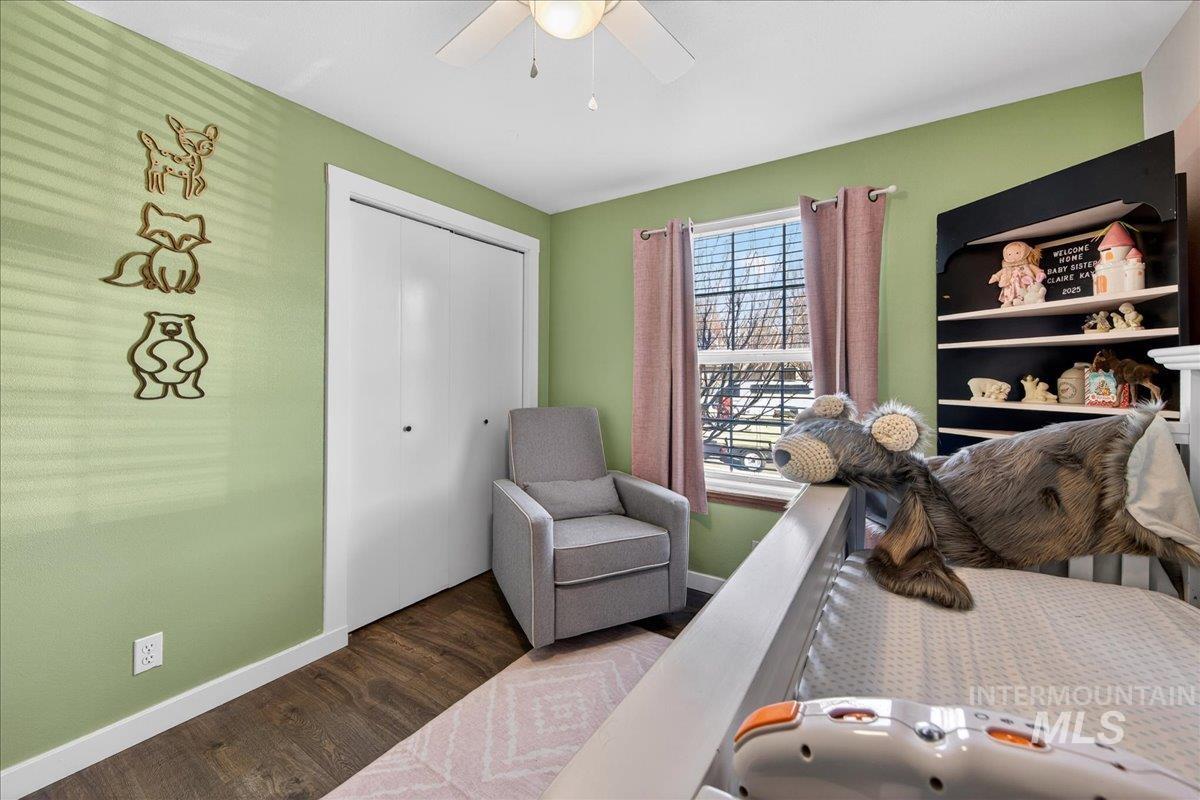 611 Northwest 15th Street Meridian, ID 83642 - Photo 14 of 35 Bedroom with wood finished floors, a closet, and ceiling fan