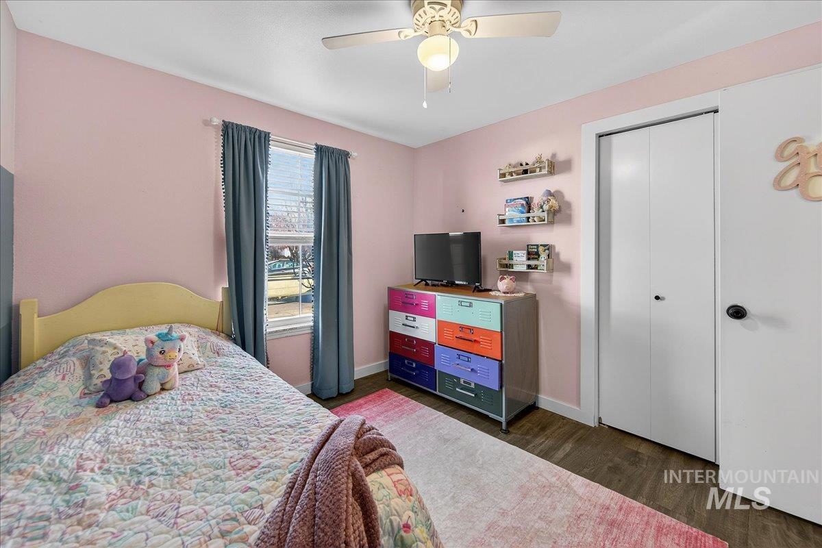 611 Northwest 15th Street Meridian, ID 83642 - Photo 17 of 35 Bedroom featuring a ceiling fan, dark wood-type flooring, and a closet