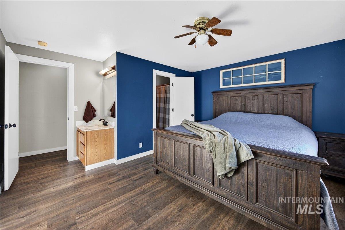 611 Northwest 15th Street Meridian, ID 83642 - Photo 19 of 35 Bedroom featuring dark wood-type flooring and a ceiling fan