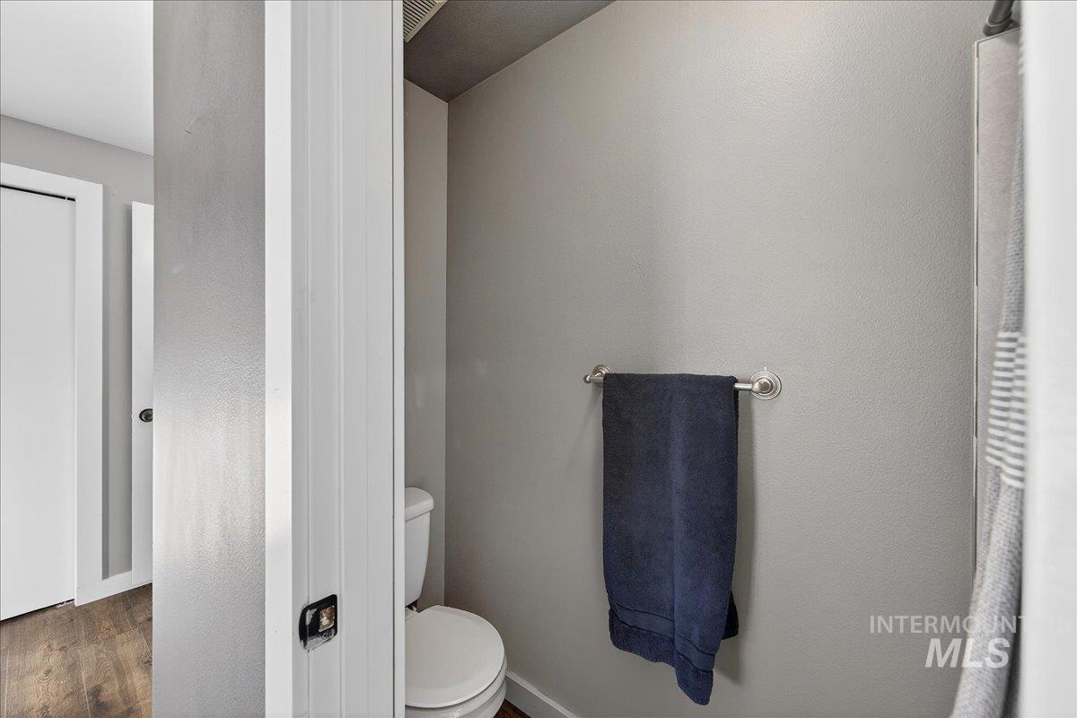 611 Northwest 15th Street Meridian, ID 83642 - Photo 23 of 35 Bathroom featuring toilet and wood finished floors