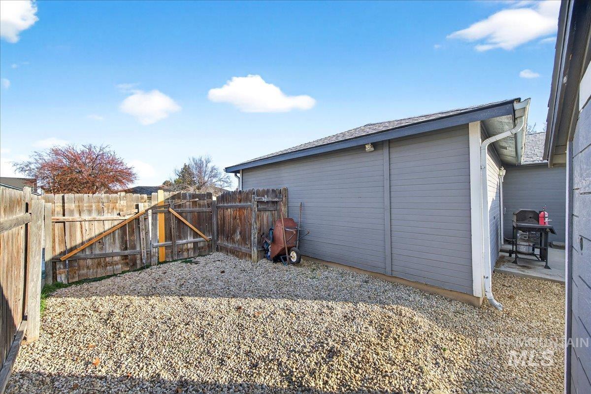 611 Northwest 15th Street Meridian, ID 83642 - Photo 28 of 35 Fenced backyard featuring a gate