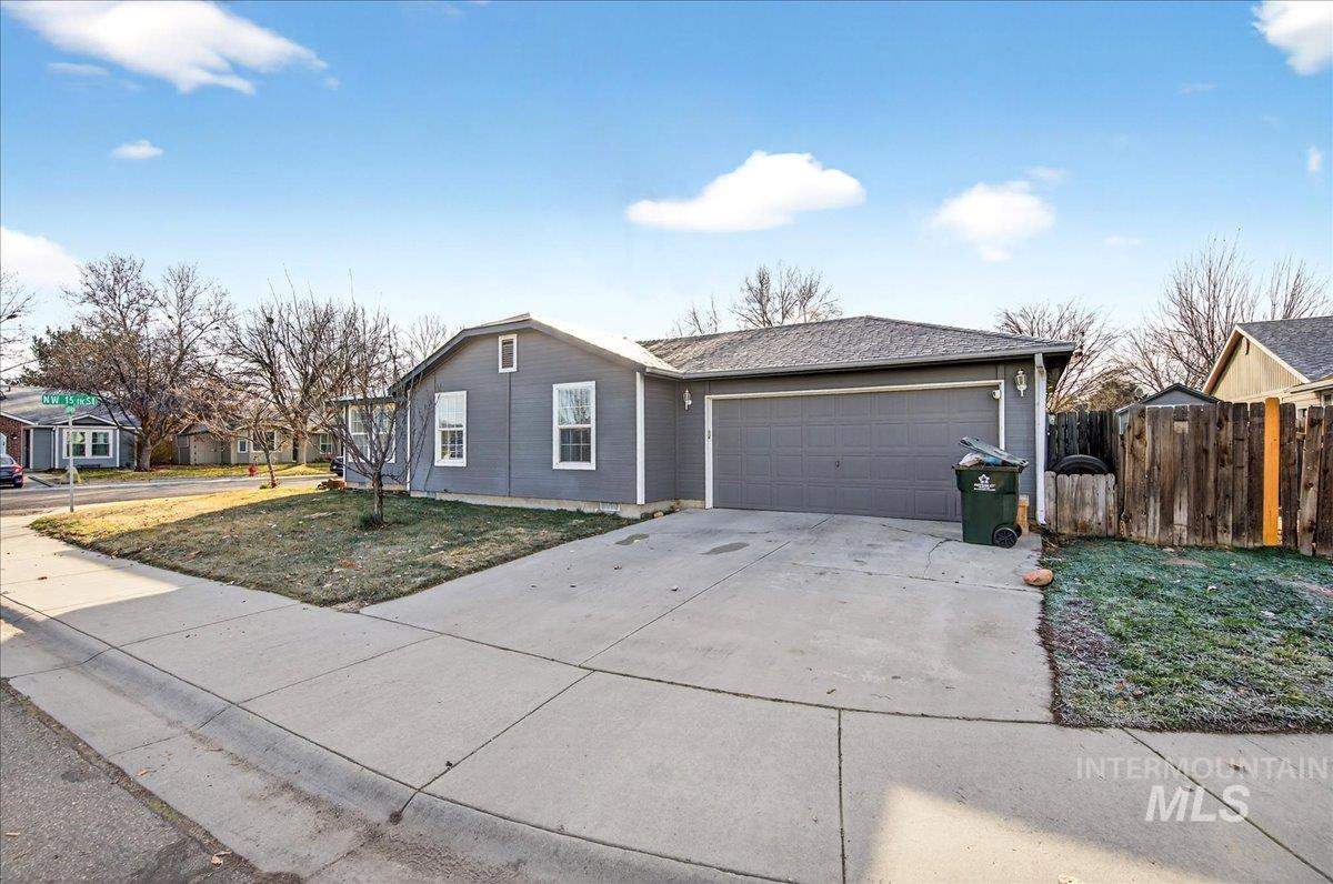 611 Northwest 15th Street Meridian, ID 83642 - Photo 34 of 35 Single story home with concrete driveway, a garage, and a residential view
