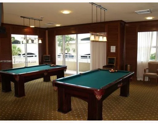 a dining room with table chairs and entryway
