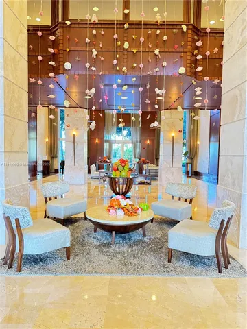 a view of a building with sitting area