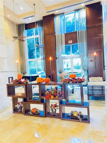 a play room with furniture and a chandelier