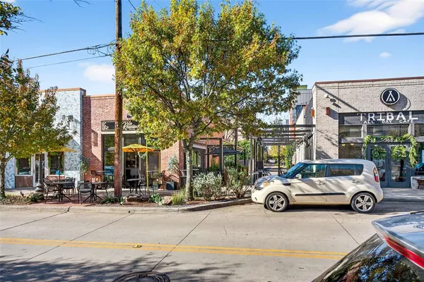 a view of street with parked cars