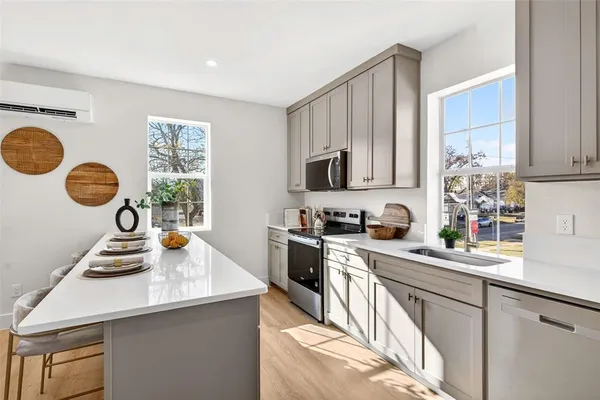 a kitchen with a dining table and chairs