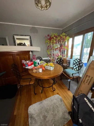 a outdoor dining space with furniture and rug