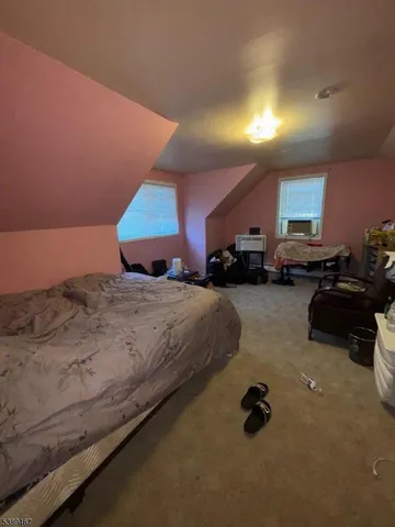 a bed room with a bed and a chair