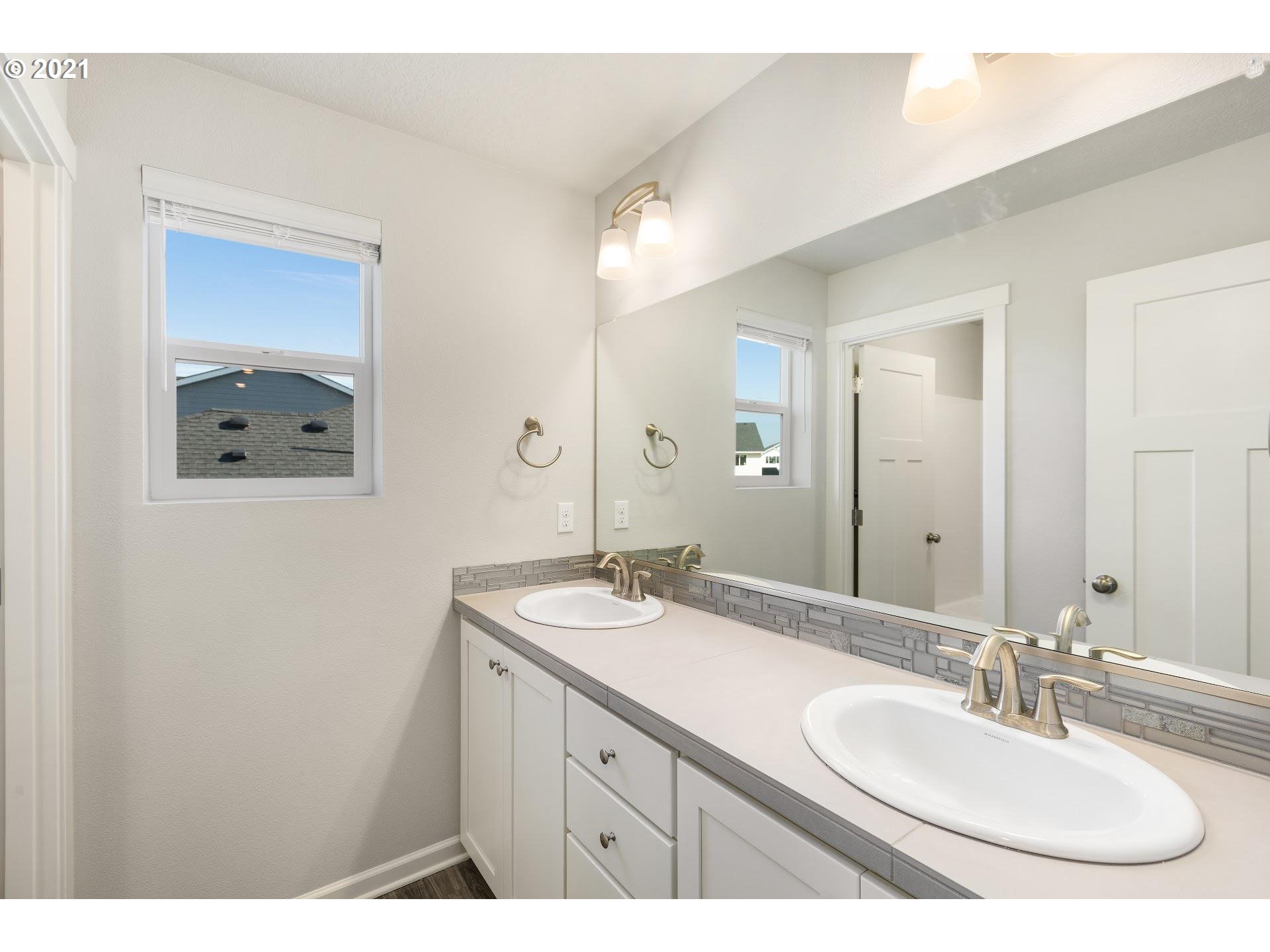 3745 South 42nd Place Ridgefield, WA 98642 - Photo 12 of 23 a bathroom with a sink and a mirror