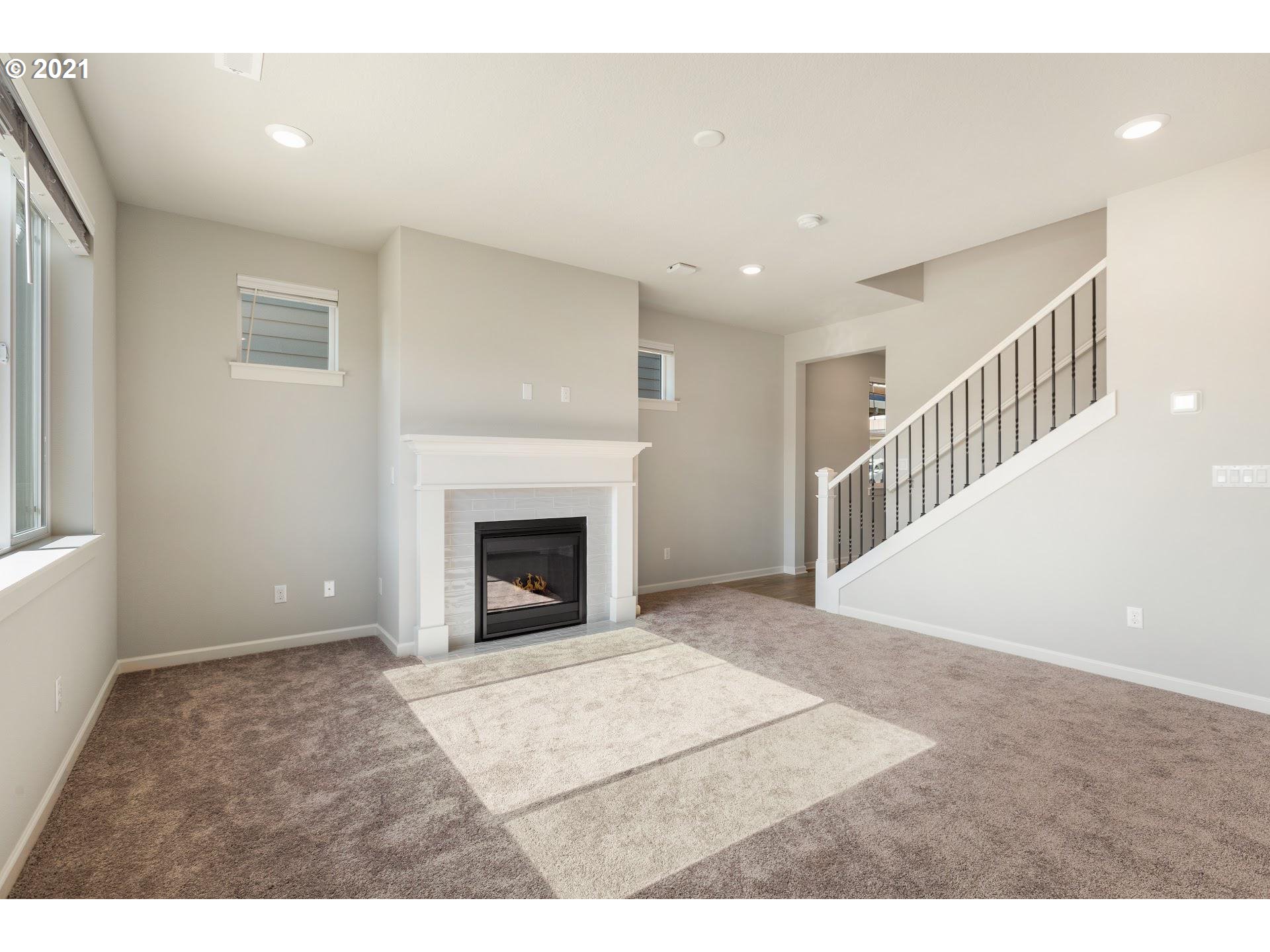 3745 South 42nd Place Ridgefield, WA 98642 - Photo 8 of 23 a view of an empty room with wooden floor and a window