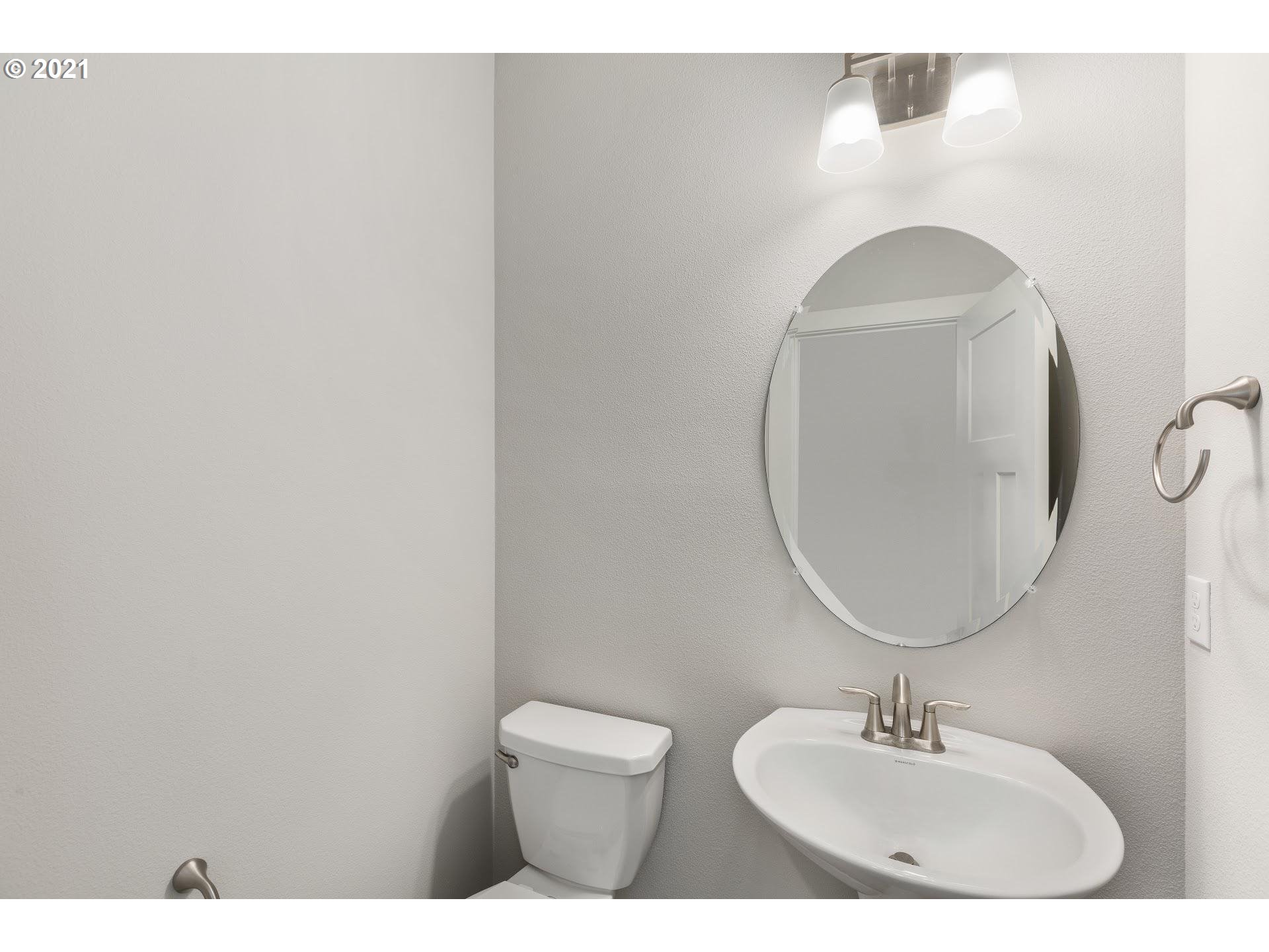 3745 South 42nd Place Ridgefield, WA 98642 - Photo 9 of 23 a bathroom with a sink and a mirror