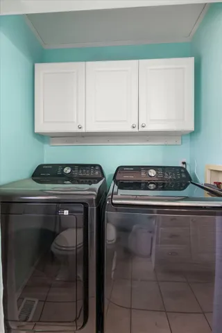 a kitchen with a stove and a cabinets