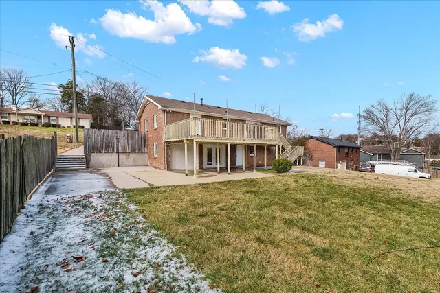 an aerial view of a house with swimming pool and ocean view