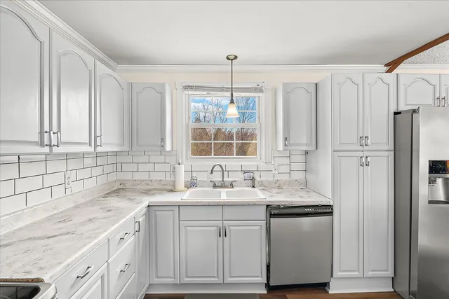 a bathroom with a sink vanity granite tub and shower