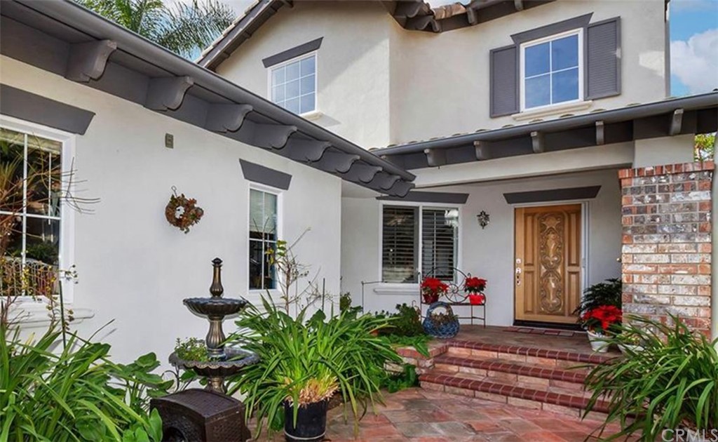 Front large tiled Courtyard greets you!  Welcome to 3 Altimira, Coto de Caza