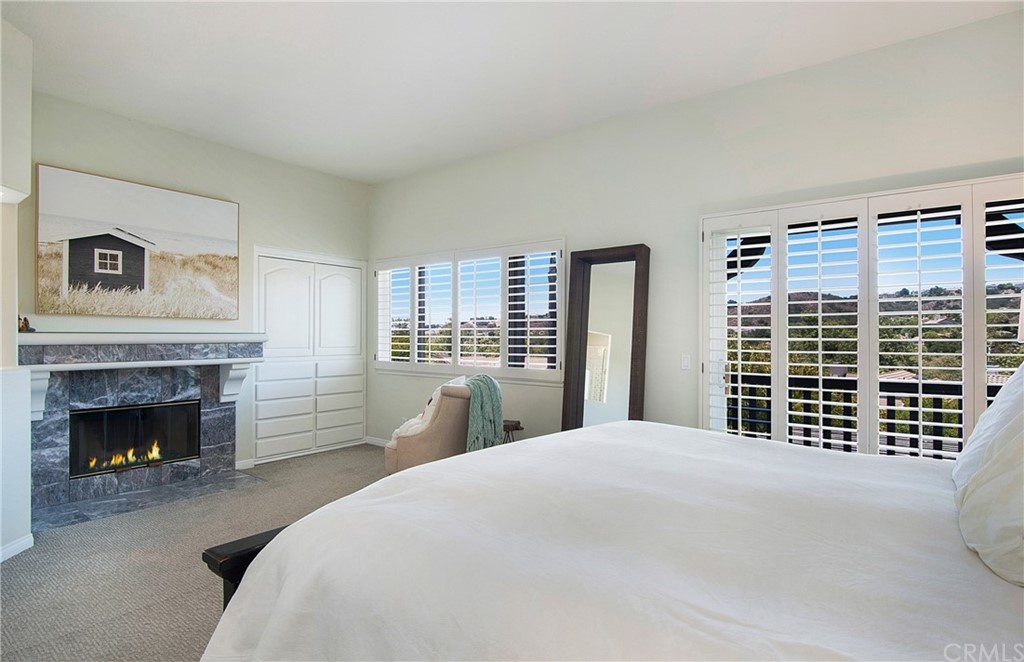3 Altimira Coto de Caza, CA 92679 - Photo 20 of 38 Fireplace in Master Bedroom for chilly nights. To the right of fireplace is a beautiful built-in storage area with drawers.