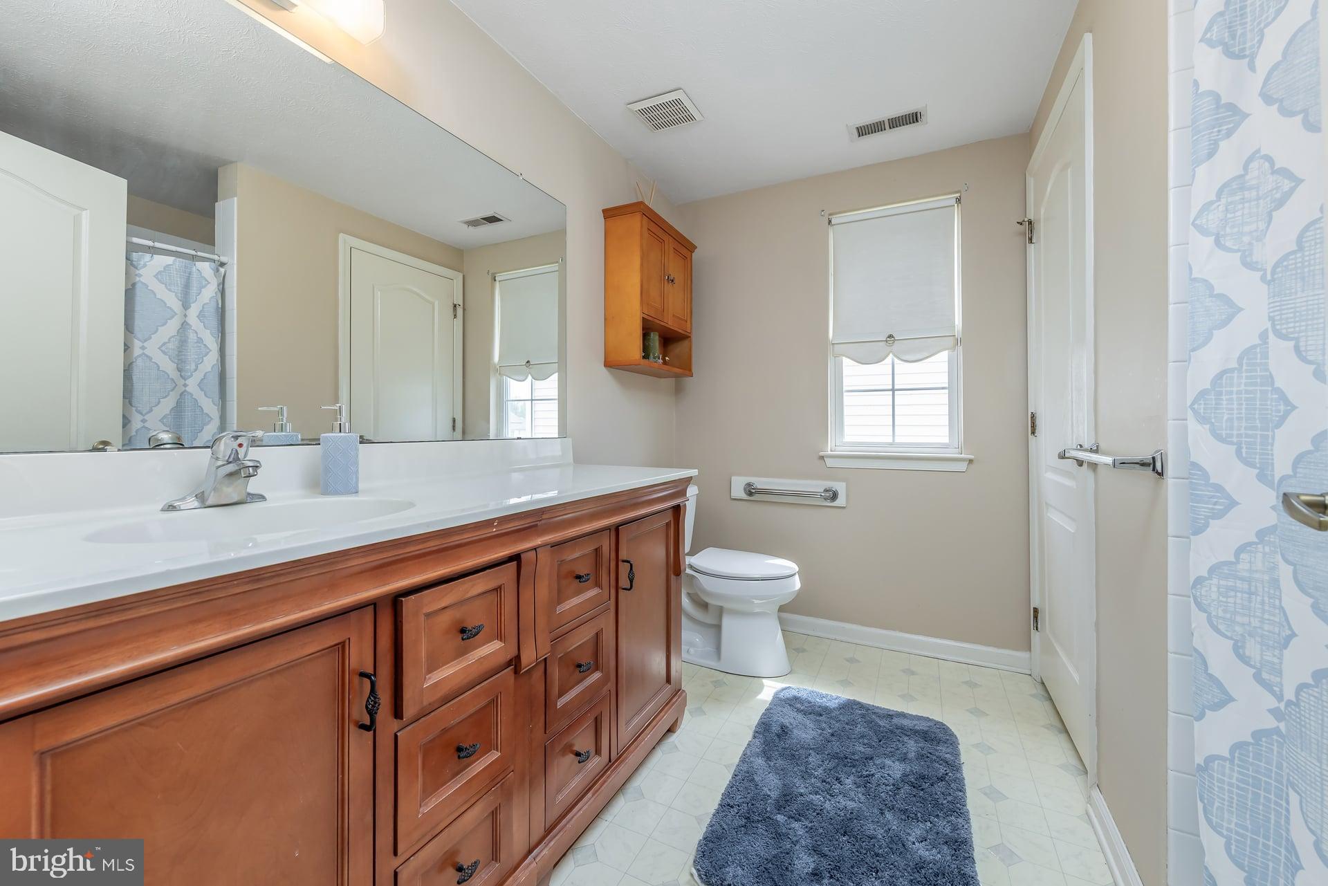 41 Grandview Place Sewell, NJ 08080 - Photo 13 of 23 a spacious bathroom with a sink a toilet and a mirror
