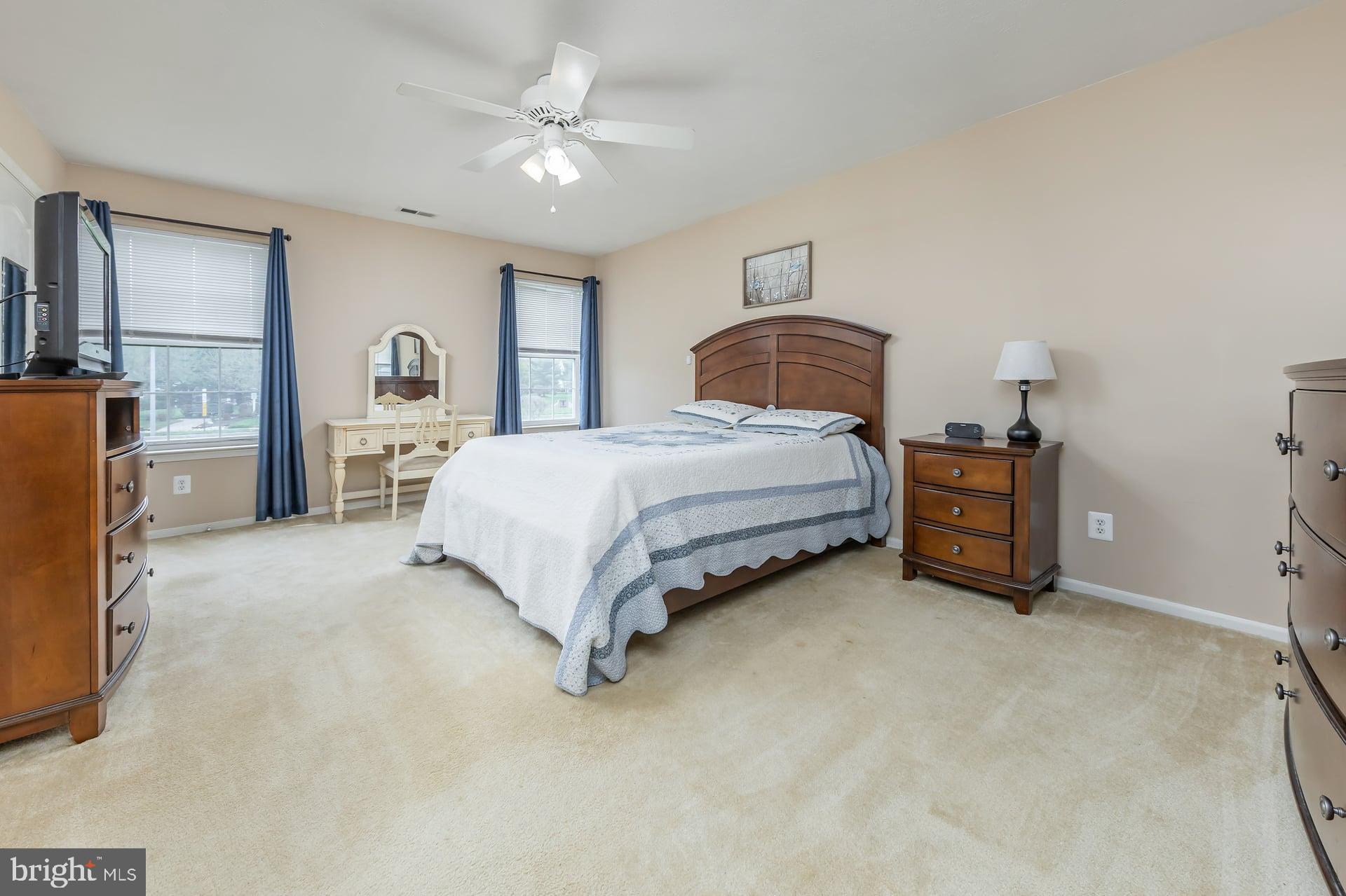 41 Grandview Place Sewell, NJ 08080 - Photo 14 of 23 a spacious bedroom with a bed and a chandelier
