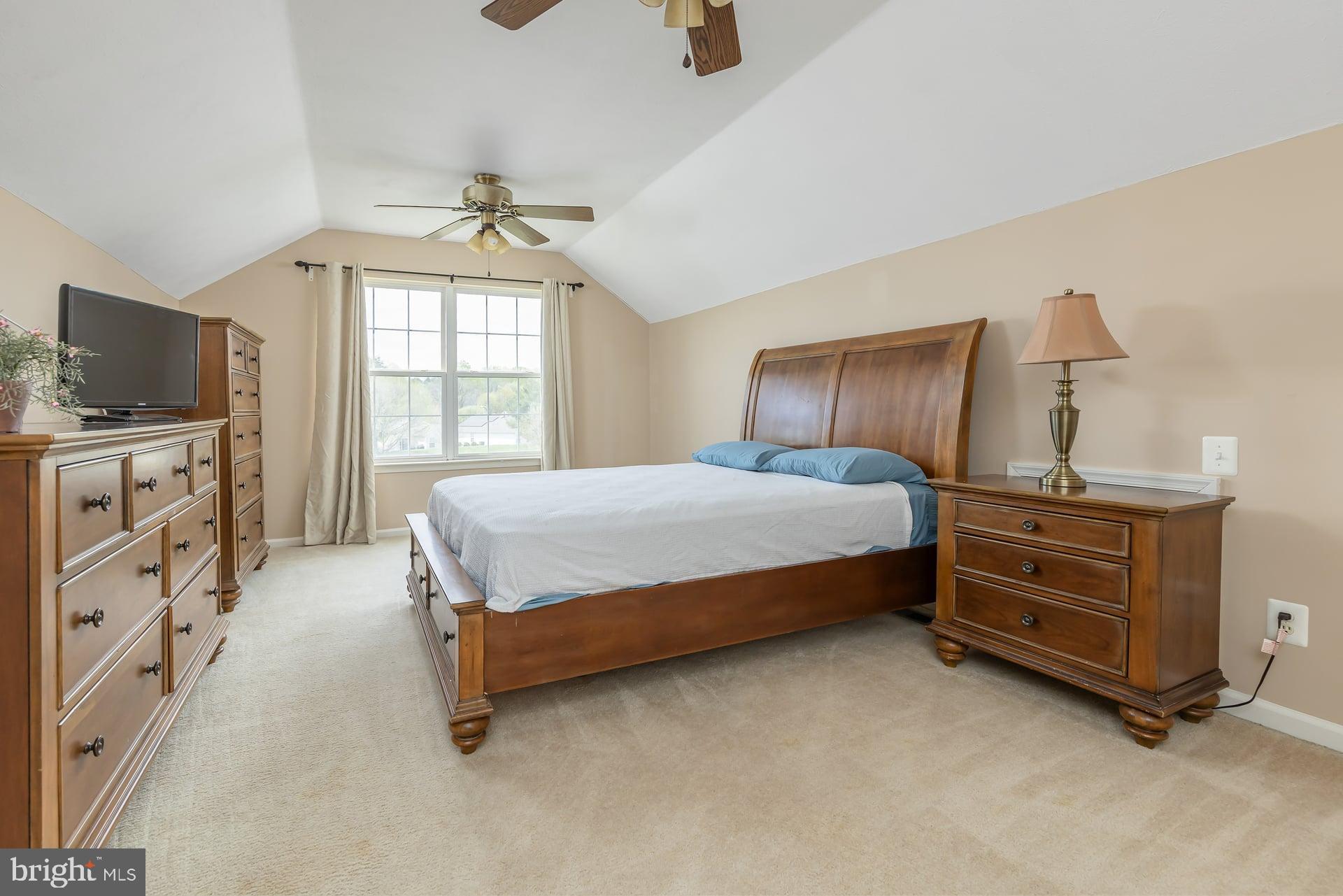 41 Grandview Place Sewell, NJ 08080 - Photo 18 of 23 a bedroom with a bed and a flat tv screen on dresser